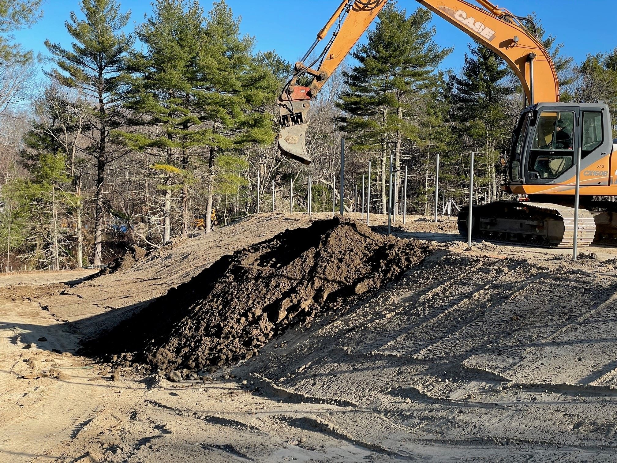 Shaping and Loam Installation on Back Slope Areas